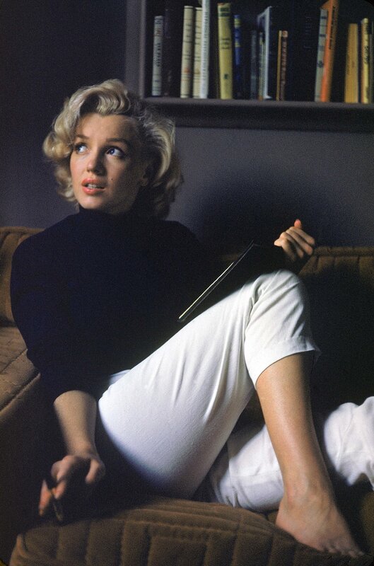 Woman Sitting on Couch — Black, Relaxed, Photograph, Bookshelf, Turtleneck