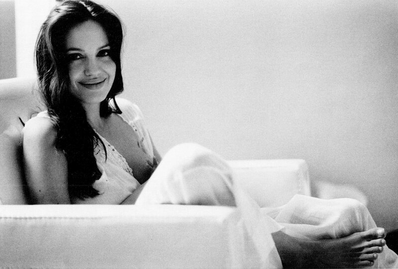 Woman Sitting on Couch — Black, Relaxed, Photograph, Pillow, Legs
