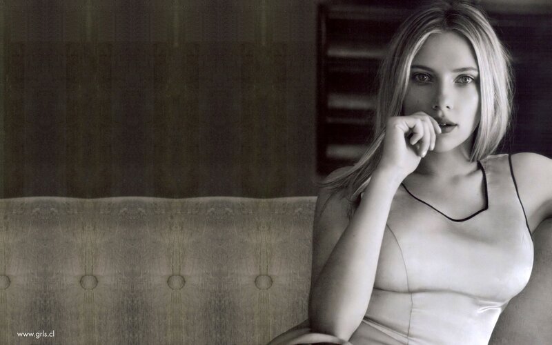 Woman Sitting on Couch — Black, Serious, Photograph