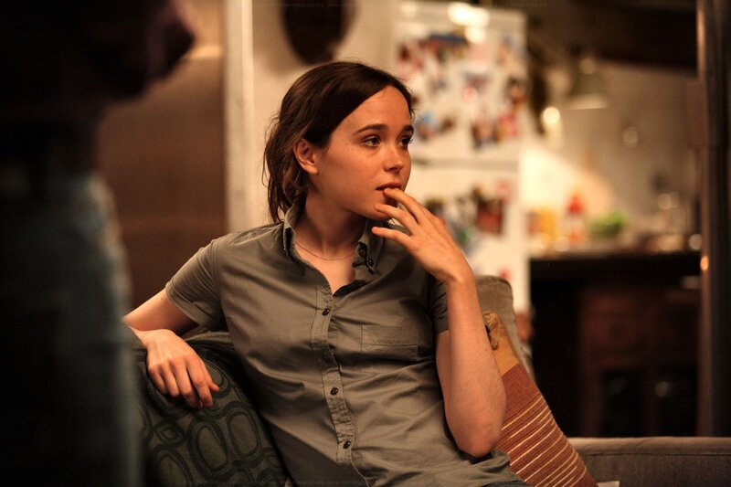 woman sitting on couch in kitchen