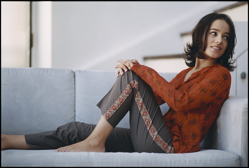 Woman Sitting on Couch — Orange, Relaxed, Afternoon