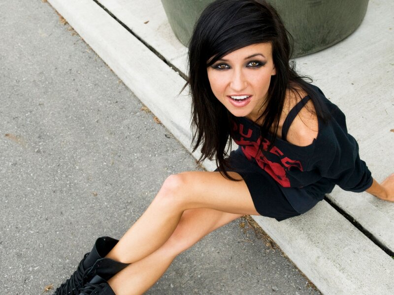 woman sitting on curb