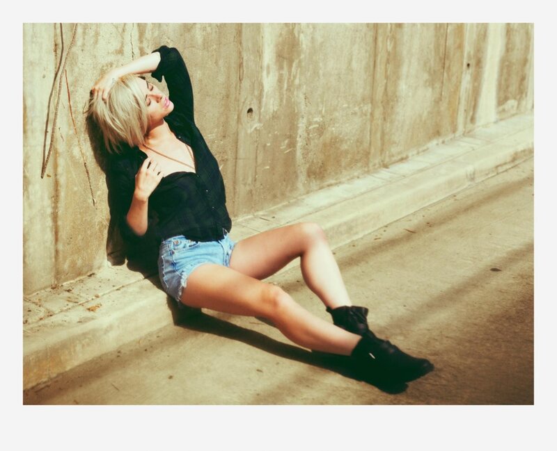 Woman Sitting on Curb — Beige