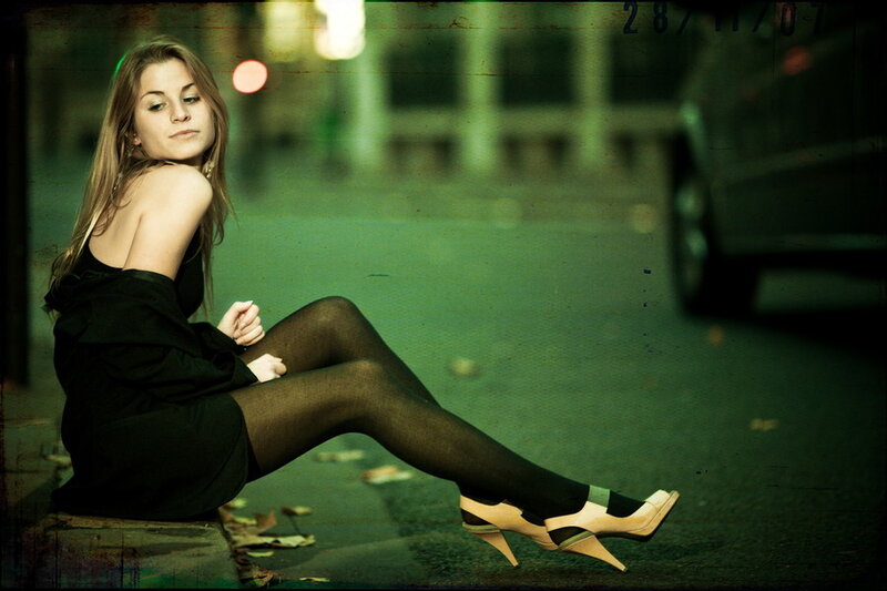 Woman Sitting on Curb — Black, Dramatic