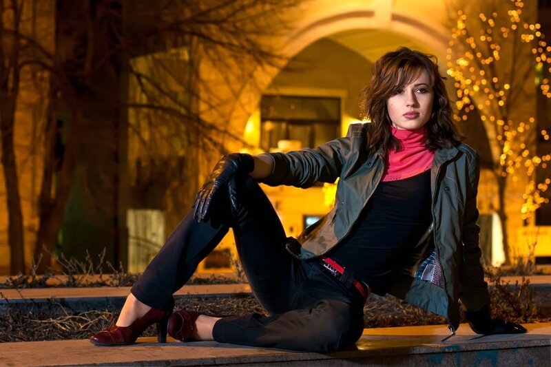 Woman Sitting on Curb — Black