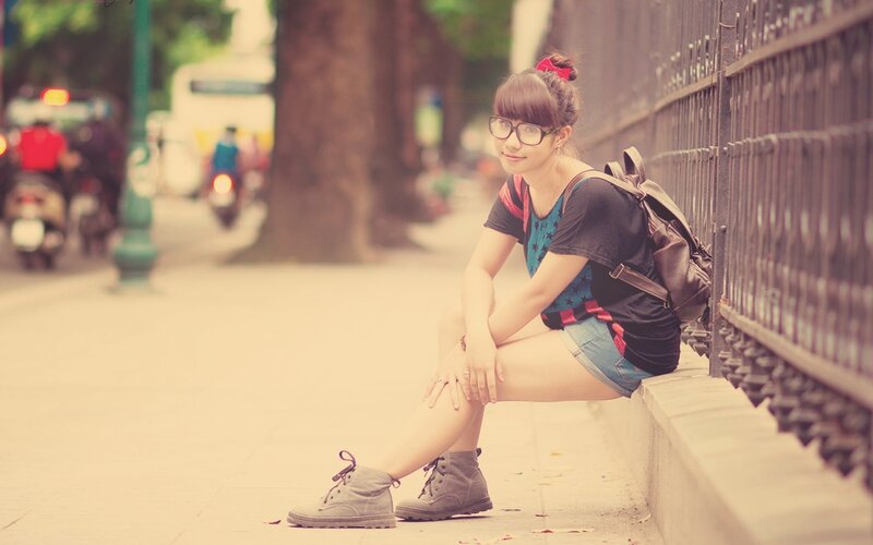Woman Sitting on Curb — Brown