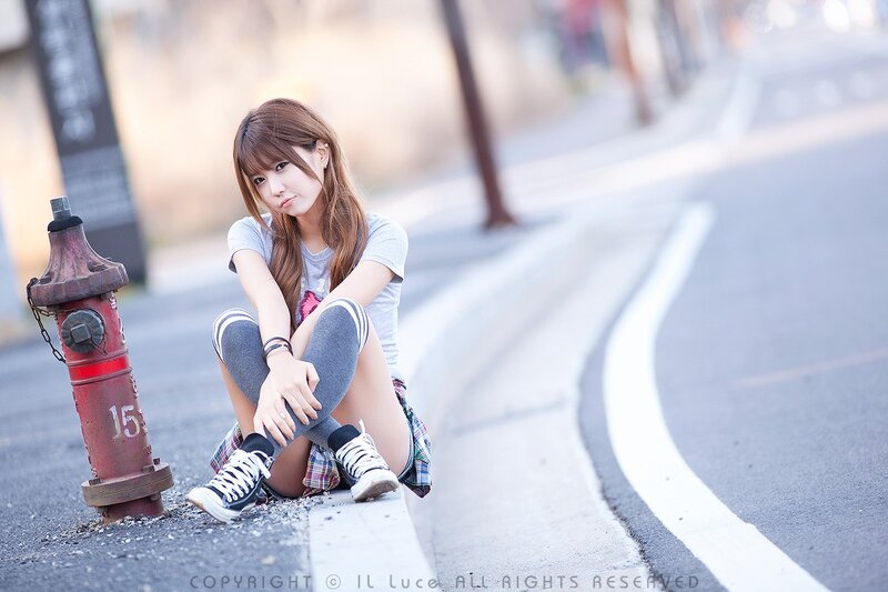 Woman Sitting on Curb — Gray, Contemplative