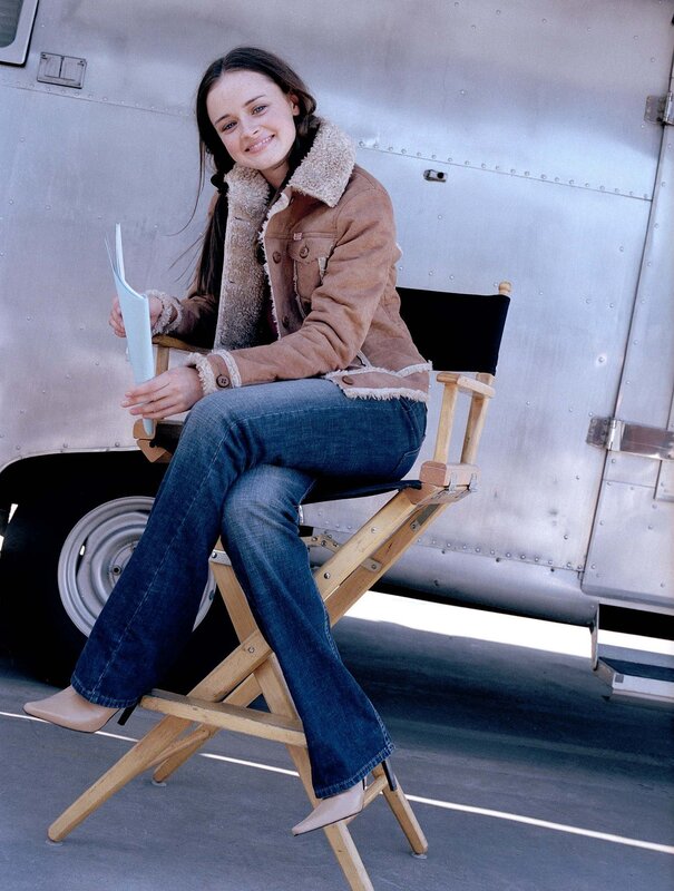 woman sitting on director's chair