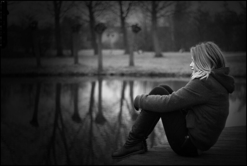 Woman Sitting on Dock — Black