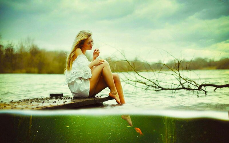 Woman Sitting on Dock — Green, Serene, Afternoon, Photograph