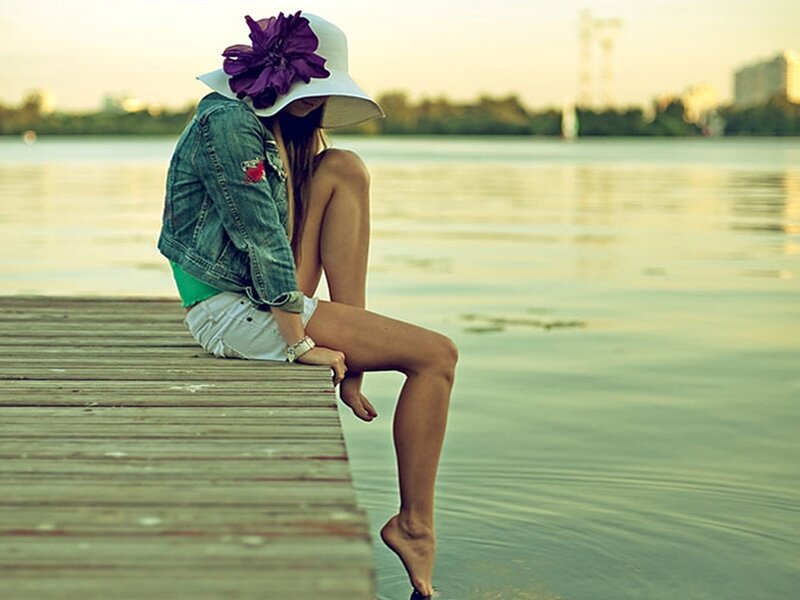 Woman Sitting on Dock — Green, Serene