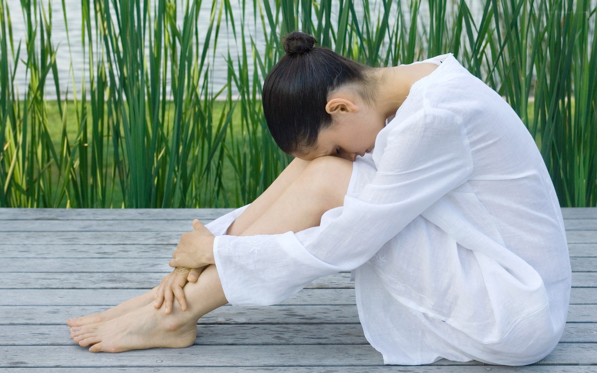 woman sitting on dock