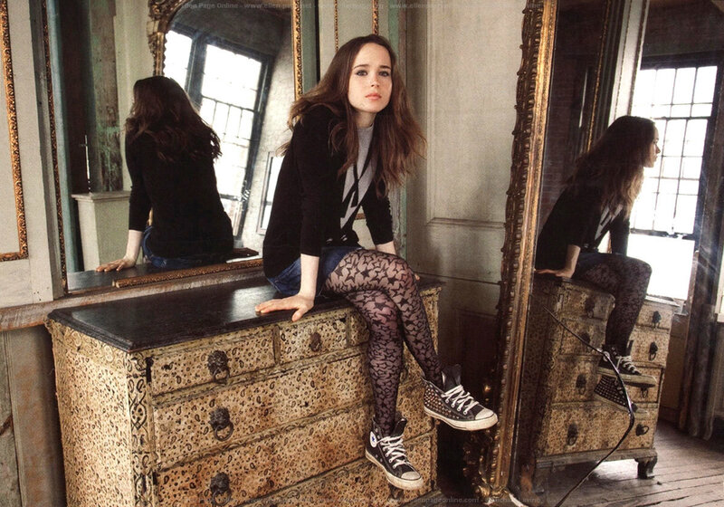 woman sitting on dresser