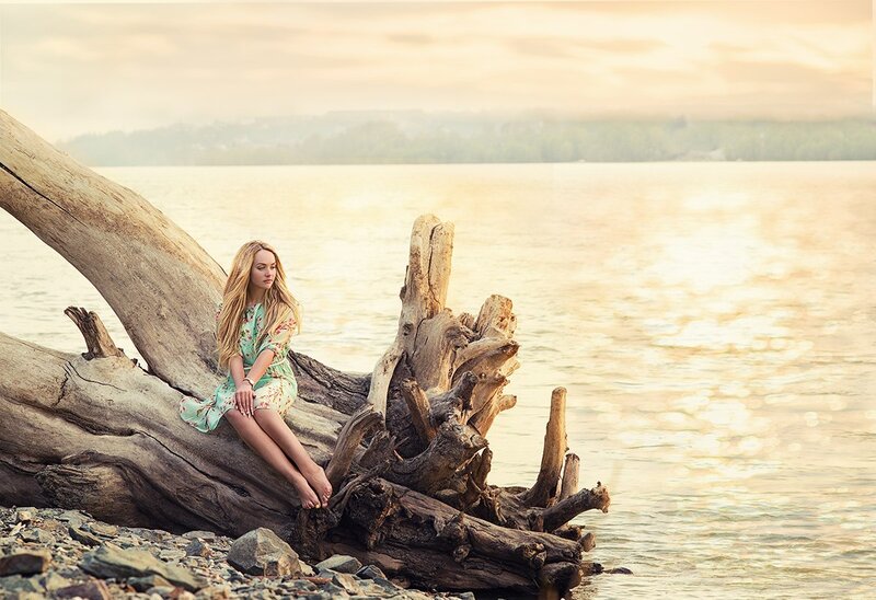 Woman Sitting on Driftwood — Beige