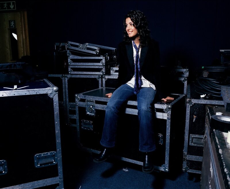 woman sitting on equipment cases