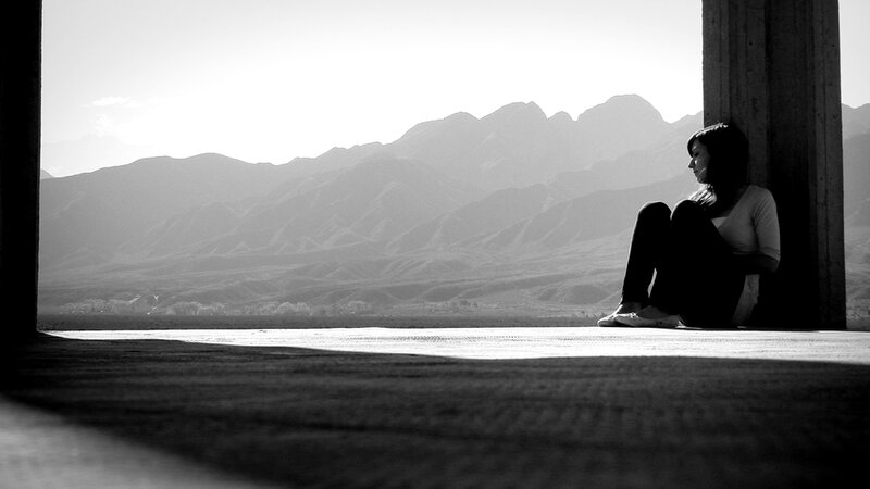 Woman Sitting on Floor — Black, Contemplative, Afternoon