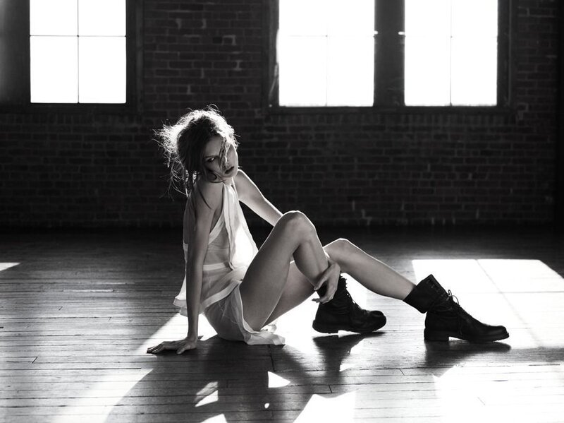 Woman Sitting on Floor — Black, Dramatic, Photograph, Brick Wall