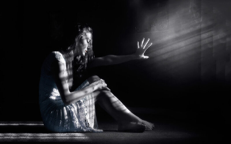 Woman Sitting on Floor — Black, Dramatic, Photograph, Light Beams