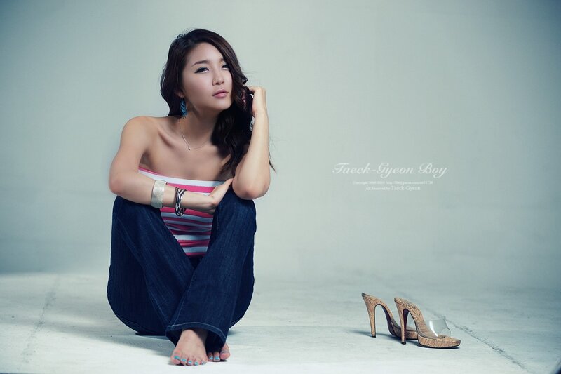 Woman Sitting on Floor — Blue, Contemplative, Photograph, Jeans