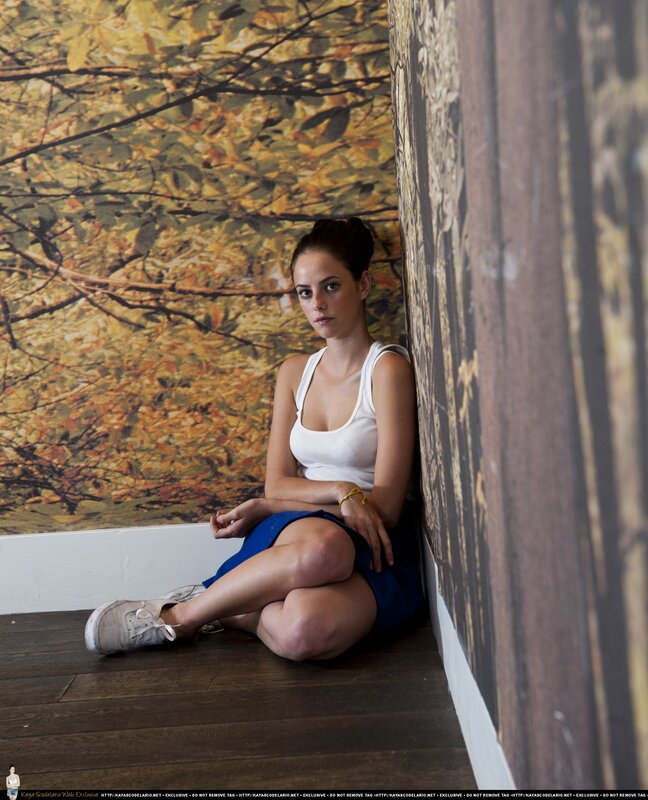 woman sitting on floor in art gallery