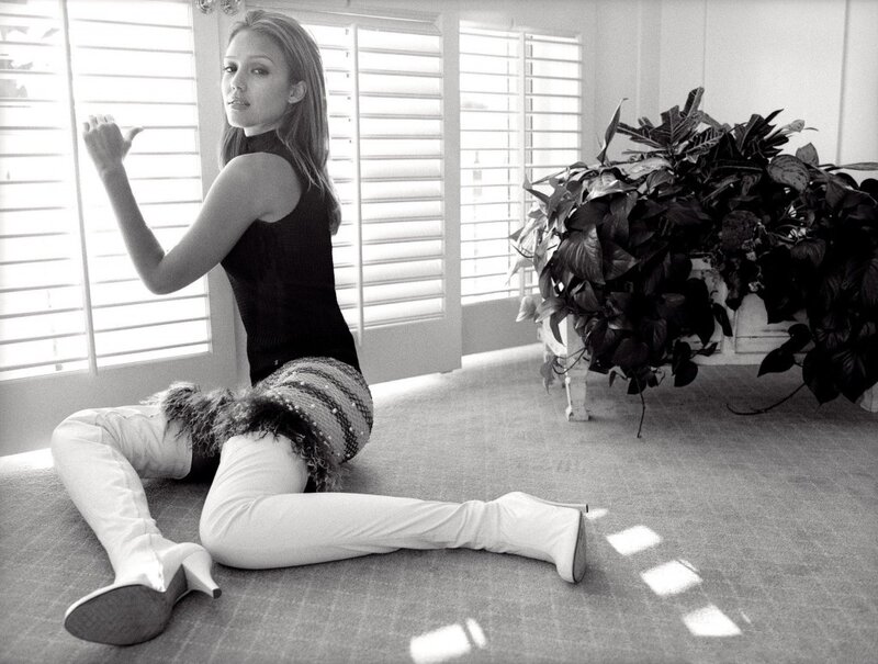 woman sitting on floor in black and white