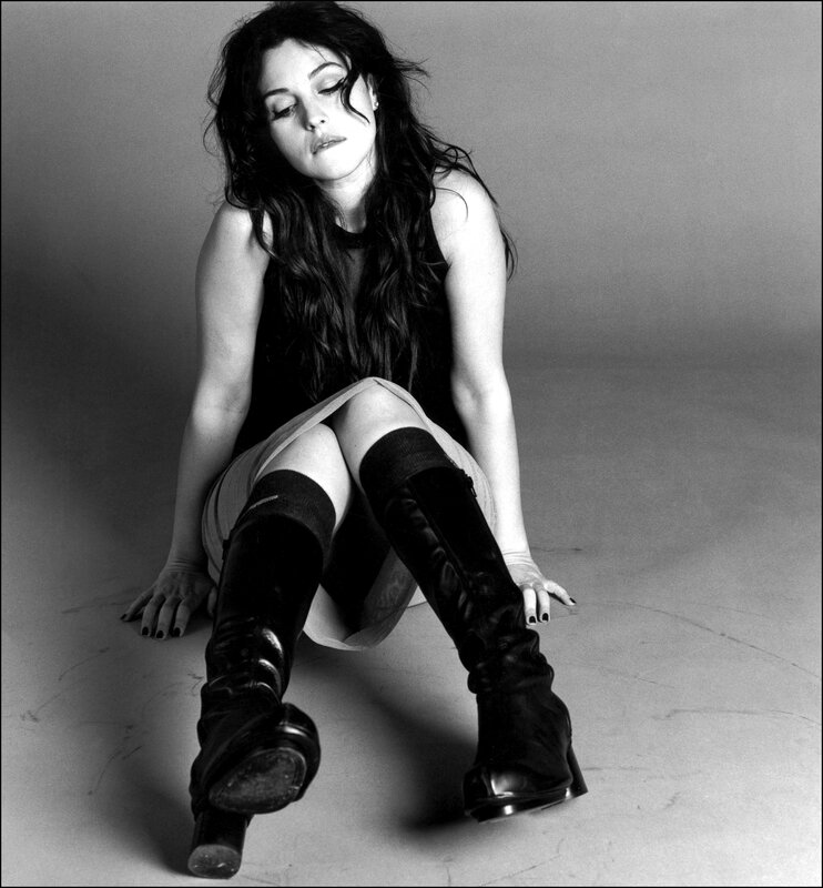 woman sitting on floor in boots