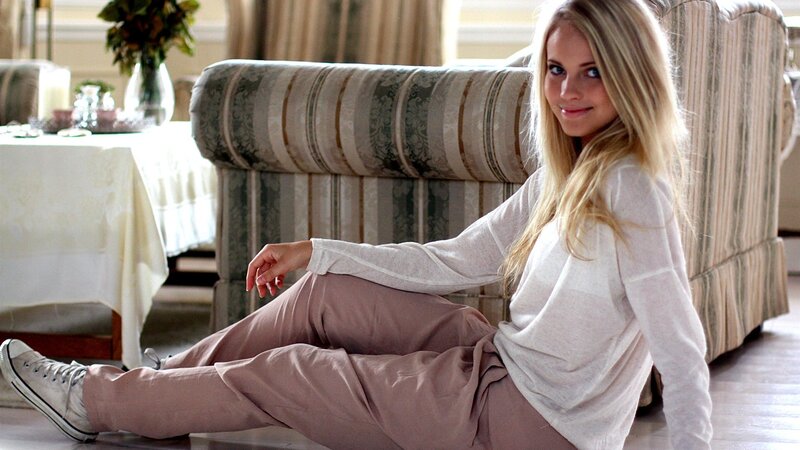 woman sitting on floor in living room