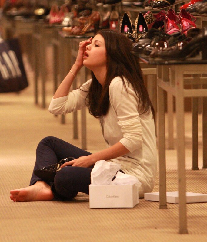 woman sitting on floor in shoe store