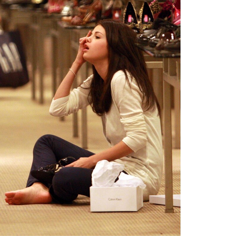 woman sitting on floor in store