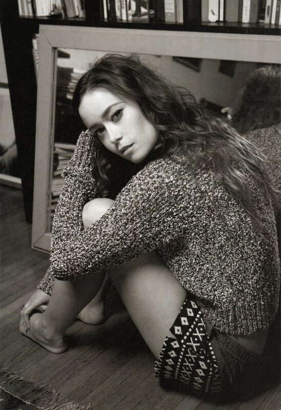 woman sitting on floor in sweater
