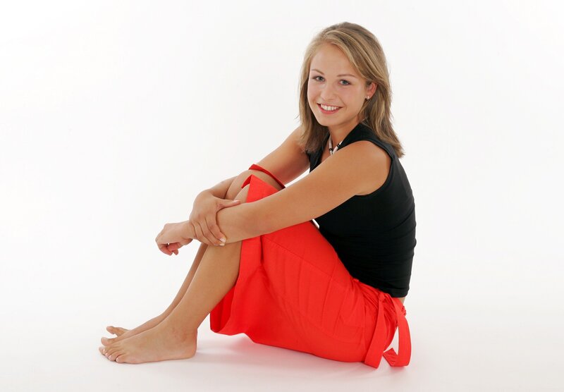 Woman Sitting on Floor — Red, Neutral, Photograph, Black Top