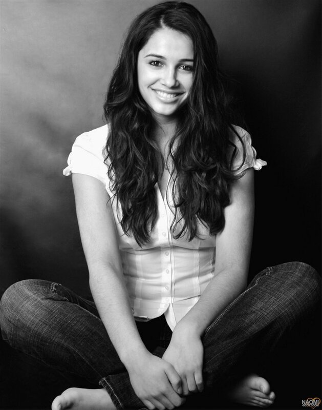 woman sitting on floor smiling