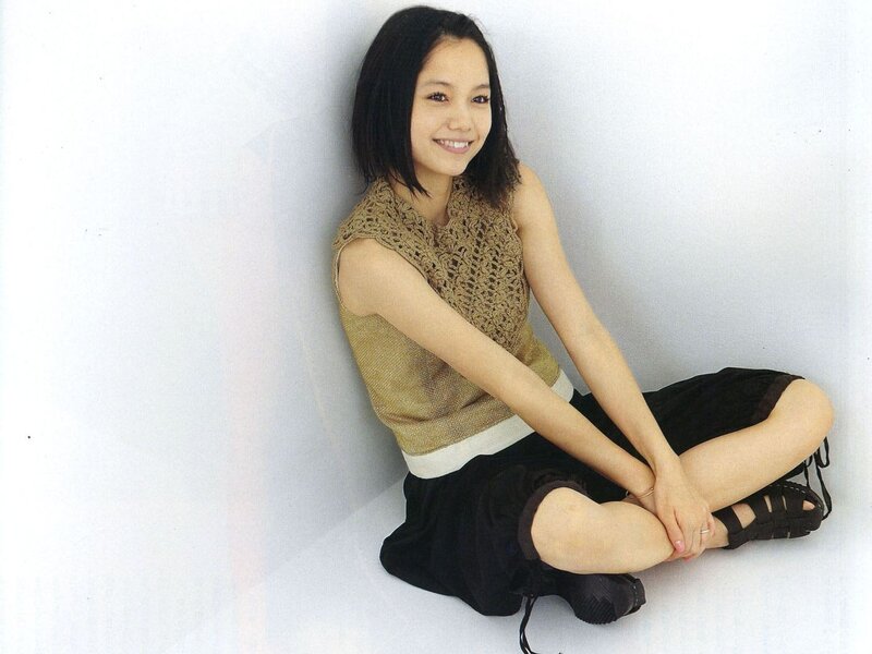 woman sitting on floor smiling