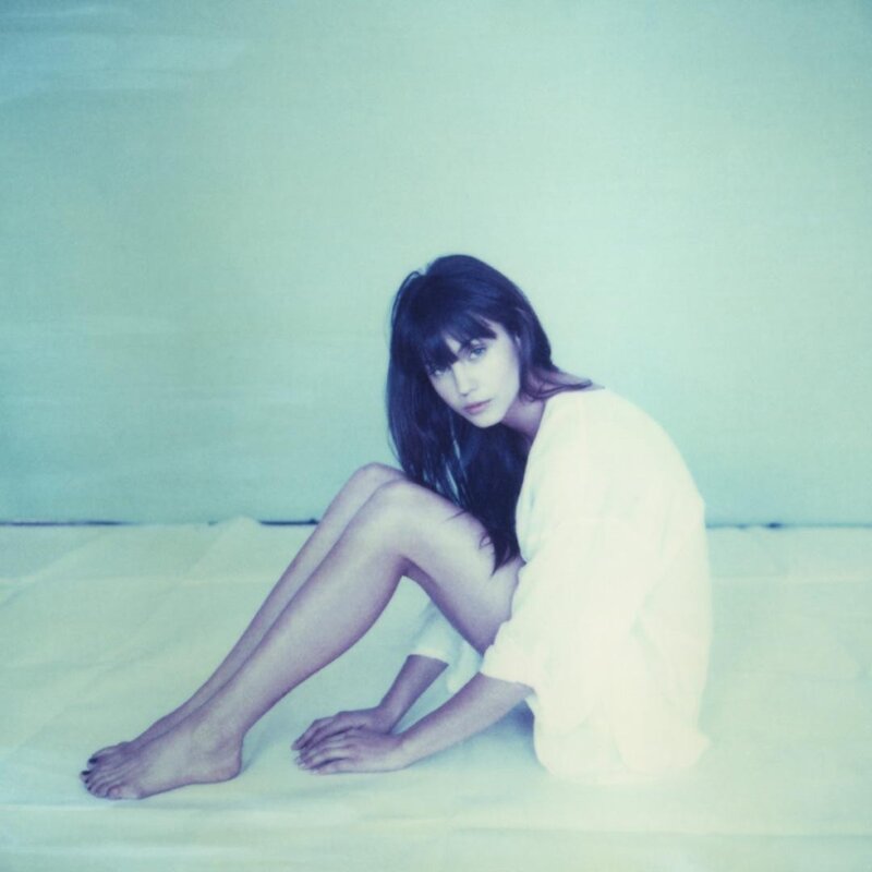 Woman Sitting on Floor — White, Calm, Photograph, Wall, Shirt