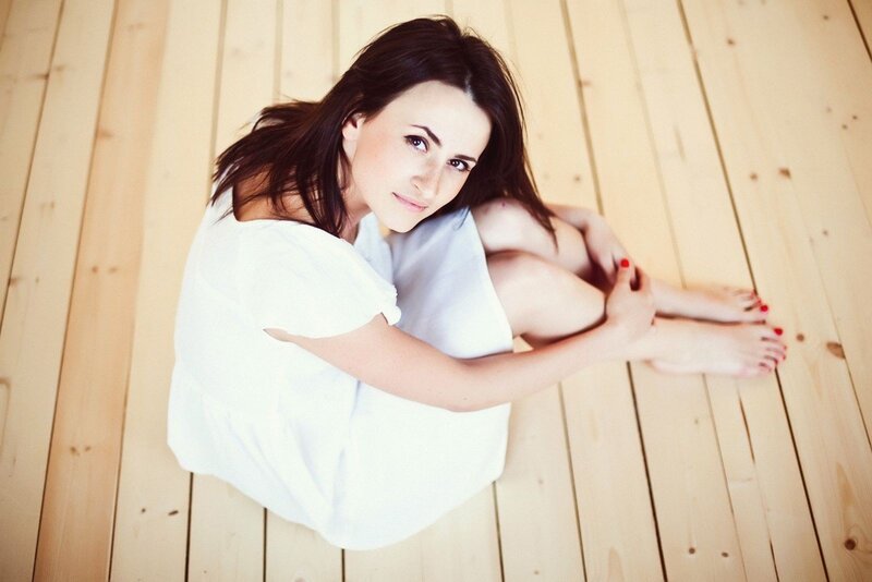 Woman Sitting on Floor — White, Calm, Photograph, Wooden Floor, White Shirt