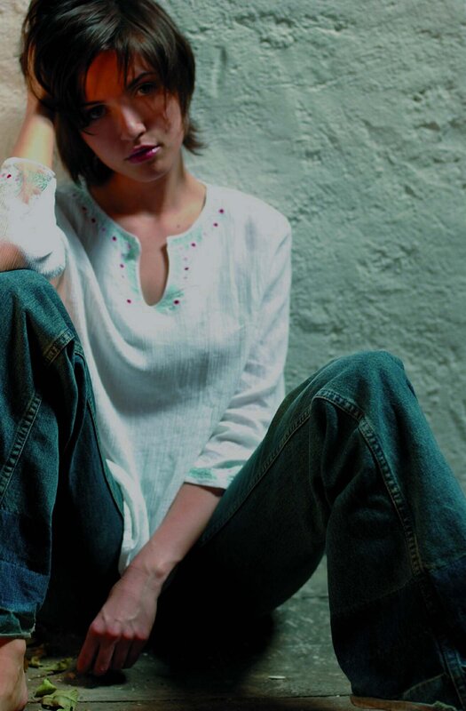 Woman Sitting on Floor — White, Contemplative, Photograph, Jeans