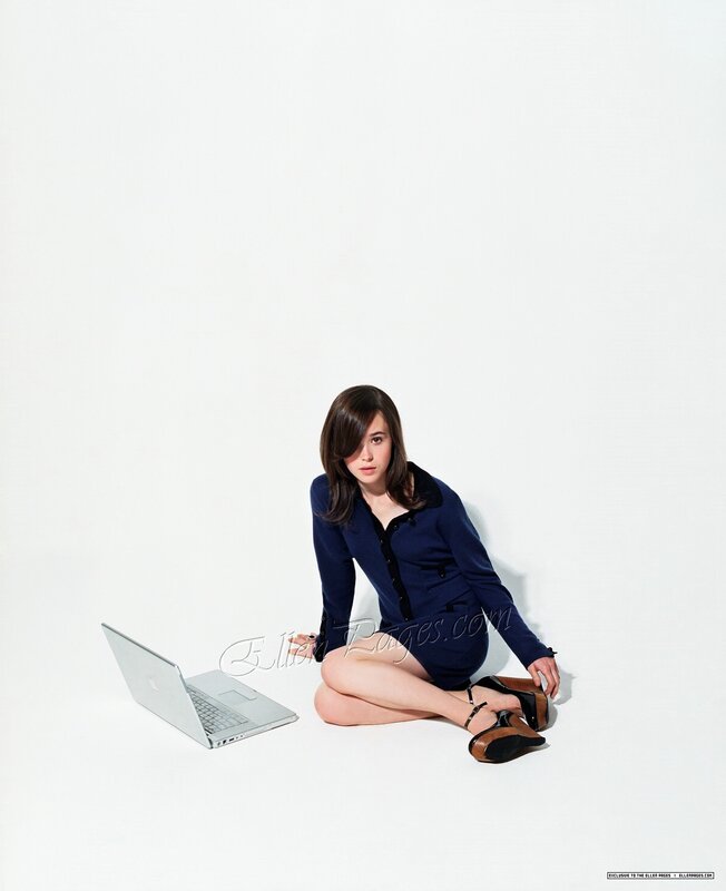 Woman Sitting on Floor — White, Neutral, Photograph, Laptop, Shoes
