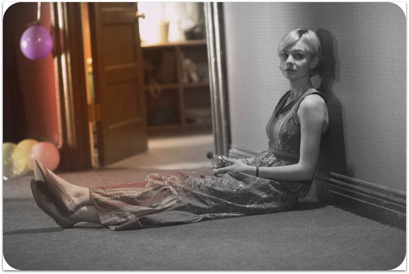 woman sitting on floor with bottle