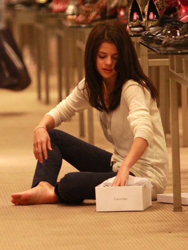 woman sitting on floor with shoe box