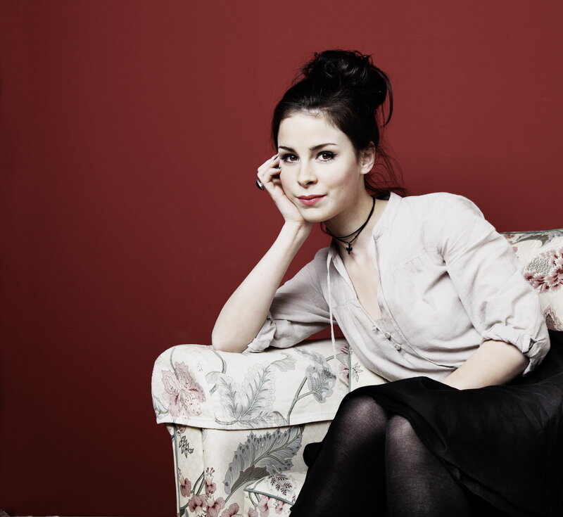 woman sitting on floral couch