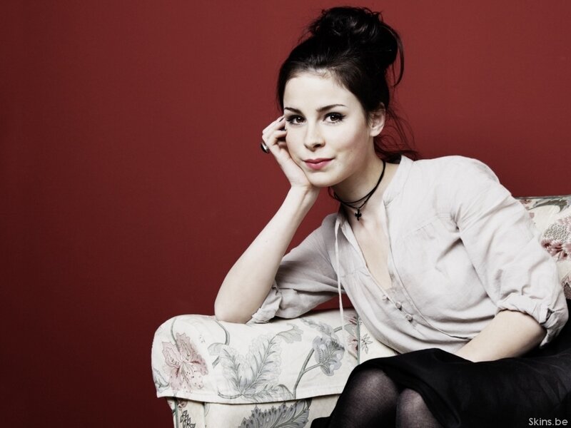 woman sitting on floral couch