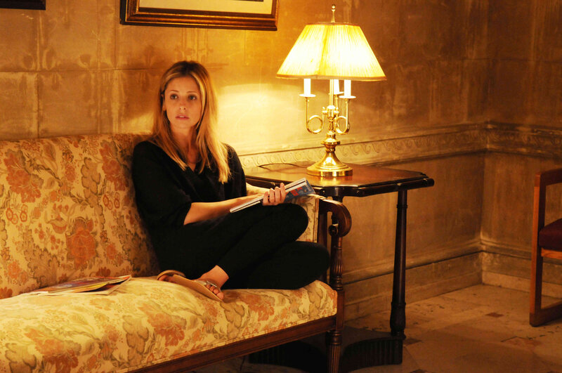 woman sitting on floral couch