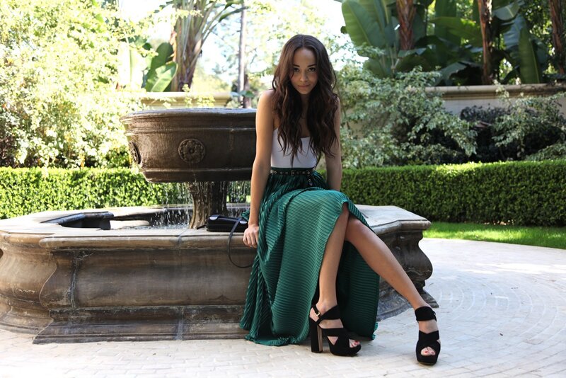 Woman Sitting on Fountain