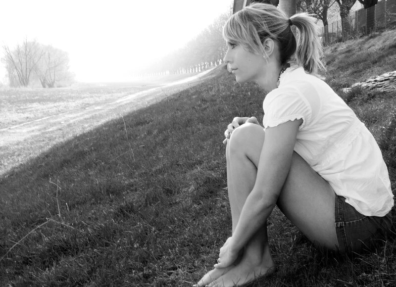 woman sitting on grass
