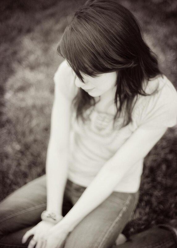 woman sitting on grass