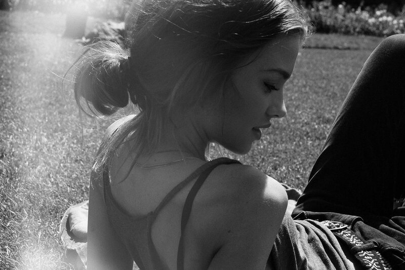 Woman Sitting on Grass — Black, Serene