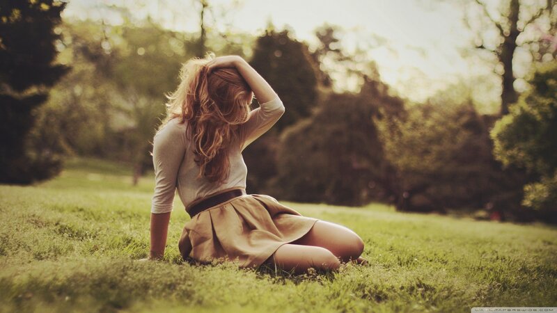 Woman Sitting on Grass — Photograph