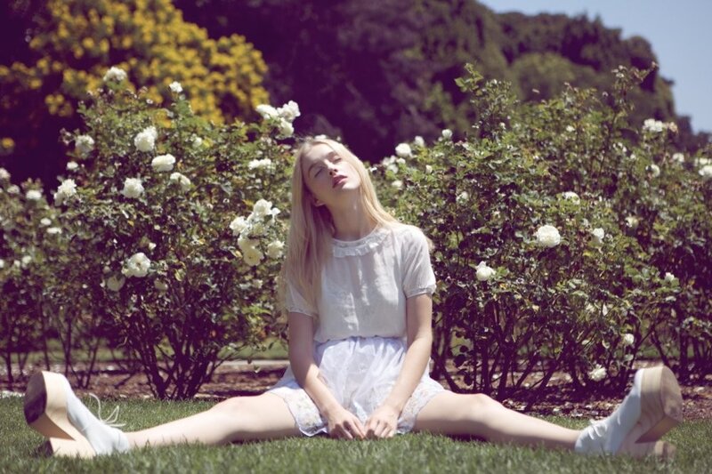 Woman Sitting on Grass — White, Serene, Afternoon