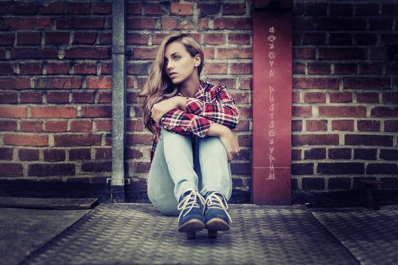woman sitting on ground