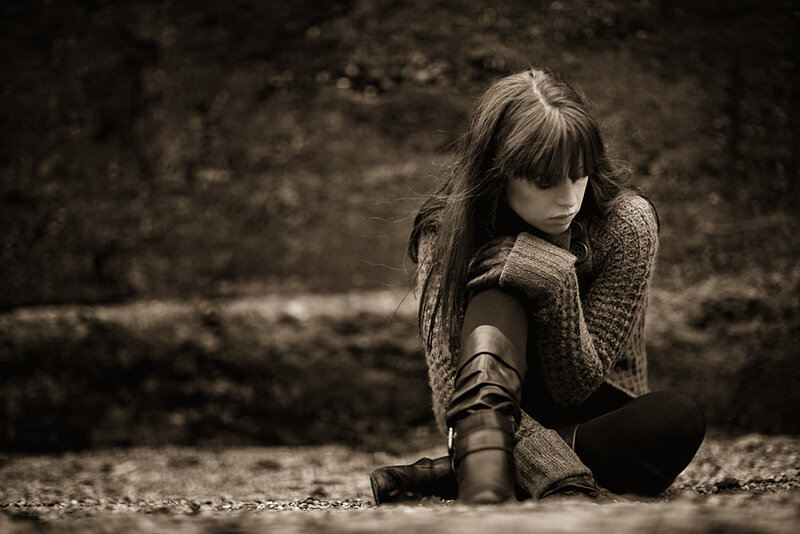 woman sitting on ground